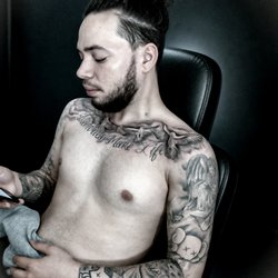Professional tattoo studio in Fayetteville, GA specializing in custom tattoos, realism, cover-ups, portraits, and piercings.