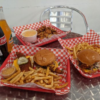 Mean Chix - Top is fried pickles. Left is their combo 2 which has a tender and a slider. The right is their sandwich and fries. - Chicken Wings Near Me - Lynwood, California