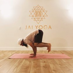 Jai Yoga Studio - Jai Singh, founder of Jai Yoga, in "Crow Pose" in the Jai Yoga Studio.