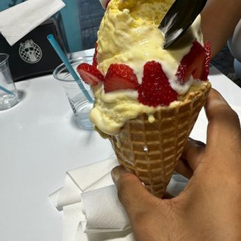 The Dolly Llama Uptown Dallas - Banana pudding with strawberries and whip cream in a waffle cone! - Waffles Near Me - Dallas, Texas