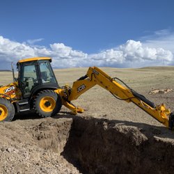Breck Snow Plow & Heavy Equipment - Digging out a septic system hole in Hartsel.