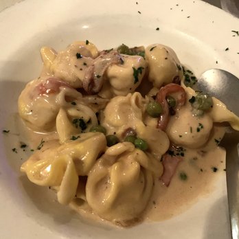 Sole Italian Restaurant - Small Fiocchi appetizer (pasta purses stuffed with 3 cheeses and pear, in a Michelangelo sauce, heavy ream base, green peas and prosciutto) - Italian Near Me - Myrtle Beach, South Carolina Sole Italian Restaurant - Small Fiocchi appetizer (pasta purses stuffed with 3 cheeses and pear, in a Michelangelo sauce, heavy ream base, green peas and prosciutto) - Italian Near Me - Myrtle Beach, South Carolina