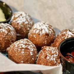 Lula B's Breakfast Brunch and Bar - Panikeke-

Fluffy fritters, crafted from a light, sweet batter laced with ripe bananas for a fruity delight.