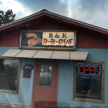 B & K Bar B Que - Three tables out outside eating area under carport. - Barbeque Near Me - Clanton, Alabama