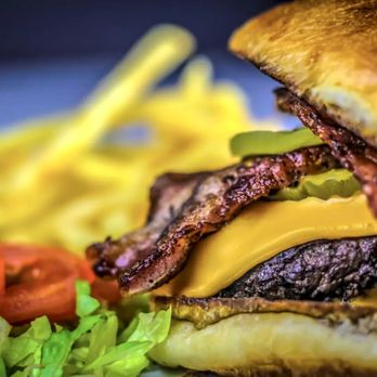 SteakStop - a plate of fries and a burger - Food Trucks Near Me SteakStop - a plate of fries and a burger - Food Trucks Near Me