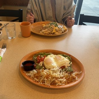Scramblers - a man sitting at a table with a plate of food - American Near Me - Lewis Center, Ohio Scramblers - a man sitting at a table with a plate of food - American Near Me - Lewis Center, Ohio