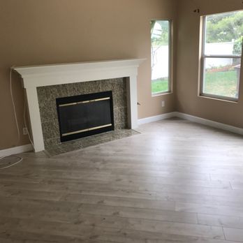 OC Premium Flooring - Intricate installation of engineered flooring around fireplace - Flooring Near Me OC Premium Flooring - Intricate installation of engineered flooring around fireplace - Flooring Near Me