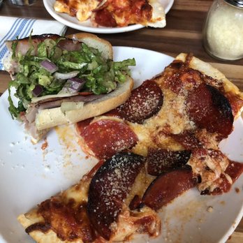 The Reveler - Half a personal pizza with half an Italian grinder sandwich - Bars Near Me - Chicago, Illinois The Reveler - Half a personal pizza with half an Italian grinder sandwich - Bars Near Me - Chicago, Illinois