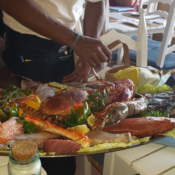 Caniço - The waiter presenting the fresh catch of the day. A wide array of seafood! - Venues & Event Spaces Near Me - Portimão, 08