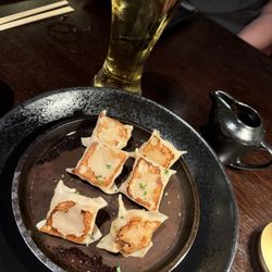 P.F. Chang's - Pan Seared Shrimp Dumplings with the sauce on the side. Pour it over the dumplings!
