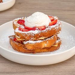 Casa Mia - Churro French Toast. 

Double dipped golden brown churro French toast topped with strawberries and our homemade whipped cream.