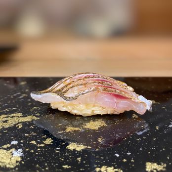 Tsubame - a piece of sushi on a table - Japanese Near Me - New York, New York Tsubame - a piece of sushi on a table - Japanese Near Me - New York, New York