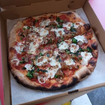 Tin Can Dough Co - Their Uncle Tony Pizza, broccoli Rabe, sausage, caramelized onions and roasted garlic - Donuts Near Me - Napanoch, New York Tin Can Dough Co - Their Uncle Tony Pizza, broccoli Rabe, sausage, caramelized onions and roasted garlic - Donuts Near Me - Napanoch, New York