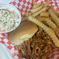 Xclusive’s Barbecue - Pulled pork sandwich, fries, and coleslaw