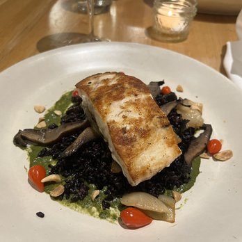 True Food Kitchen - My friend and I both ordered this black organic rice with seasonal veggies and grilled sea bass that tasted lovely! - New American Near Me - Boca Raton, Florida True Food Kitchen - My friend and I both ordered this black organic rice with seasonal veggies and grilled sea bass that tasted lovely! - New American Near Me - Boca Raton, Florida