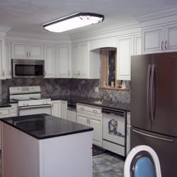 Kitchen Tune-Up - Eye-popping white kitchen with charcoal accent glazing and magnificent crown moulding detail