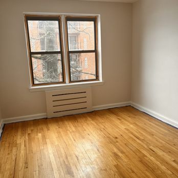 Calianese Painting - an empty room with wood floors - Painters Near Me
