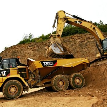 REYCON HOLDINGS CORPORATION - a dump truck and a bulldozer - General Contractors Near Me REYCON HOLDINGS CORPORATION - a dump truck and a bulldozer - General Contractors Near Me
