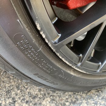Tint World - "Road Rash" metal shavings & dirt "OVER" their "delivered" tire shine compound...(I didn't have the keys?!...just sayin')...(close-up photo) - Car Stereo Installation Near Me - Bensenville, Illinois