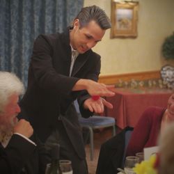 David Fung - Magician - David performing close-up magic at a formal event in Norwich