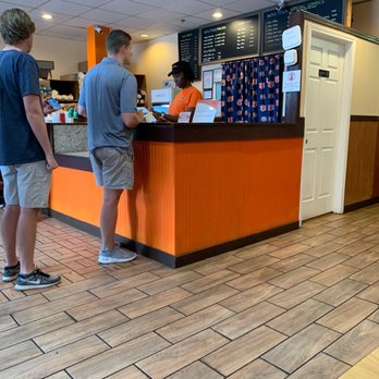 Wing Town - two men standing at a counter - Chicken Wings Near Me - Auburn, Alabama