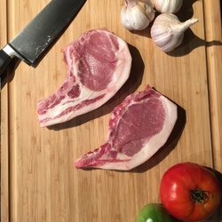Moore Natural Ranch - Heritage Pork Chops, marbled with healthy fat full of the good fatty acids for your heart .