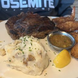 Ribeye* 13 oz. + Gold Coast Coconut Shrimp** + Loaded Mashed Potatoes