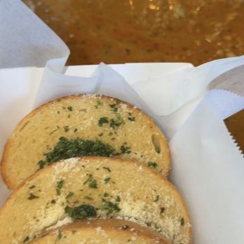 The Crab Bay - Garlic bread with the sauce covering the whole table to the point of spilling because of no trays. - Cajun/Creole Near Me - San Jose, California The Crab Bay - Garlic bread with the sauce covering the whole table to the point of spilling because of no trays. - Cajun/Creole Near Me - San Jose, California