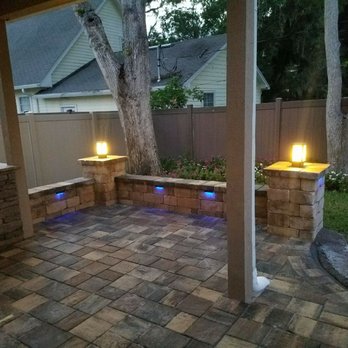 A Cut Above - a patio with a grill and lights - Landscaping Near Me - Jacksonville, Florida A Cut Above - a patio with a grill and lights - Landscaping Near Me - Jacksonville, Florida