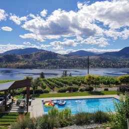 a pool with a view of a lake and mountains a pool with a view of a lake and mountains
