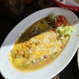 Side chicken enchiladas smothered with cheese and green chile. Side chicken enchiladas smothered with cheese and green chile.
