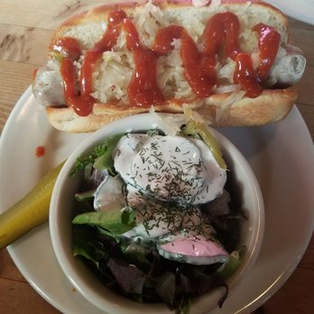 Prost! Boise - Bratwurst sandwich with gerwuzgurken - German Near Me - Boise, Idaho Prost! Boise - Bratwurst sandwich with gerwuzgurken - German Near Me - Boise, Idaho