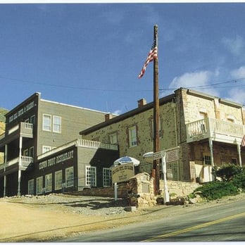 Crown Point Restaurant - Original hotel on the right, modern wing in the back, restaurant in lower left, bar under balcony. - American Near Me - Virginia City, Nevada