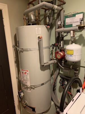 Tankless Water Heater conversion - We replaced an old tank boiler/water heater. With NEW Tankless Water heater. The unit handles radiant floor heating and potable water heating. Tankless Water Heater conversion - We replaced an old tank boiler/water heater. With NEW Tankless Water heater. The unit handles radiant floor heating and potable water heating.