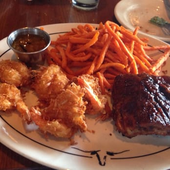 Saltgrass Steak House - Rib and coconut shrimp combo with sweet potato fries. - Steakhouses Near Me - Laughlin, Nevada Saltgrass Steak House - Rib and coconut shrimp combo with sweet potato fries. - Steakhouses Near Me - Laughlin, Nevada
