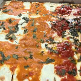 Half Grandma Vodka Sauce pizza, half Grandma pizza.