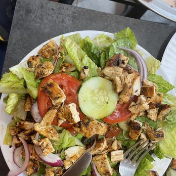 Village Pizza - a plate of chicken salad with a slice of pizza in the background - Pizza Near Me - Nyack, New York Village Pizza - a plate of chicken salad with a slice of pizza in the background - Pizza Near Me - Nyack, New York
