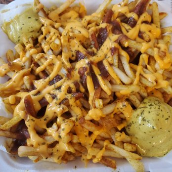 Currywurst Truck Sarasota - Fries with cheese sauce and curry ketchup - Food Trucks Near Me Currywurst Truck Sarasota - Fries with cheese sauce and curry ketchup - Food Trucks Near Me