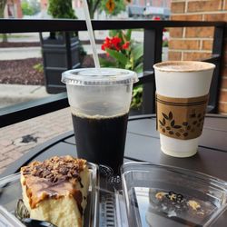 The Cheesecake Shoppe - Slice of cheesecake, hot chocolate, and cold brew on a morning mini date