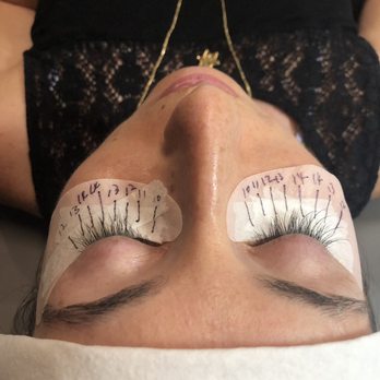 The Lash Lounge - Left eye is before and right eye is in the middle of lash extensions - Threading Services Near Me - Encinitas, California The Lash Lounge - Left eye is before and right eye is in the middle of lash extensions - Threading Services Near Me - Encinitas, California