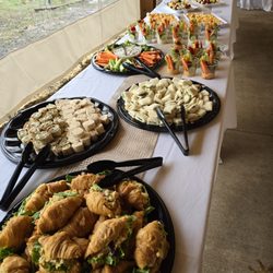 Anytime Catering - Assorted apps buffet. Mini croissants, pinwheels, veggie tray and veggie/hummus cups