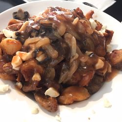 Poutineville - Poutine with hand crushed potatoes, cheese curd, mushroom, onions, gravy