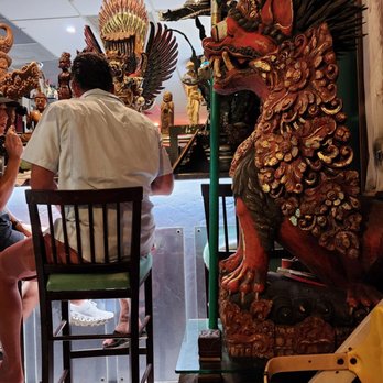 Bali Café - a man and woman sitting at a table - Sushi Bars Near Me - Miami, Florida Bali Café - a man and woman sitting at a table - Sushi Bars Near Me - Miami, Florida