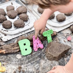 Agape Adventure Academy - St Louis Christian School, St Louis Forest School, Reading Quest for our preschoolers in the mud kitchen