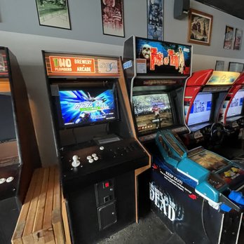 Two Plumbers Brewery + Arcade - a row of arcade machines - Breweries Near Me - Saint Charles, Missouri