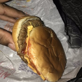 McDonald's - a hand holding a cheeseburger - Burgers Near Me - Clarksville, Tennessee McDonald's - a hand holding a cheeseburger - Burgers Near Me - Clarksville, Tennessee