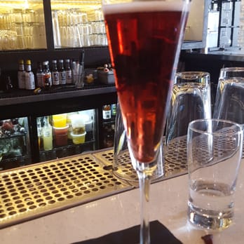 Elixir Lounge Andersonville - Signature Kir Royale with candied flower garnish - Lounges Near Me - Chicago, Illinois