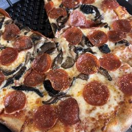 Pepperoni and mushroom pizza Pepperoni and mushroom pizza