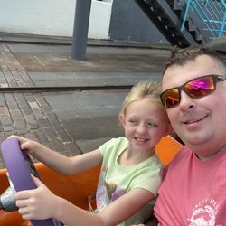 Tomorrowland Speedway - She couldn't keep her eyes off the road.