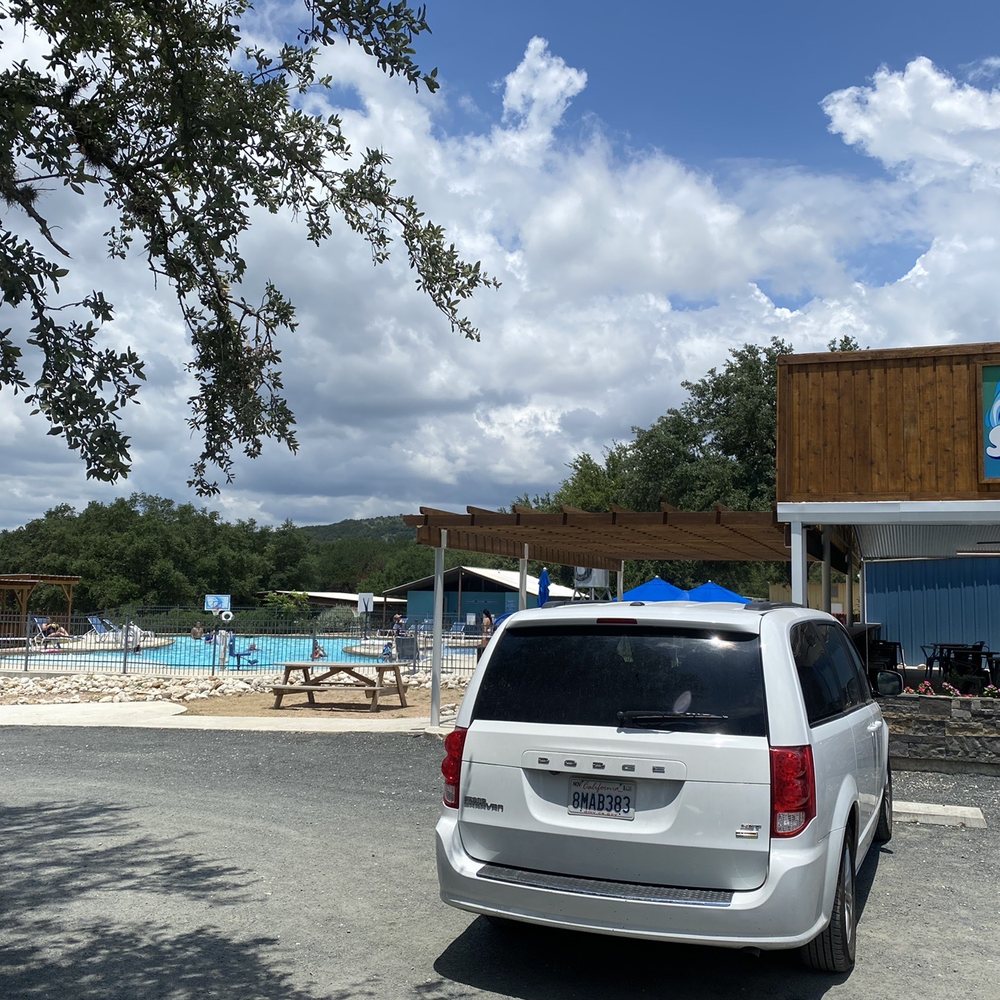 Flip Flop Pit Stop - two cars parked in front of a pool - Convenience Stores Near Me - Concan, Texas